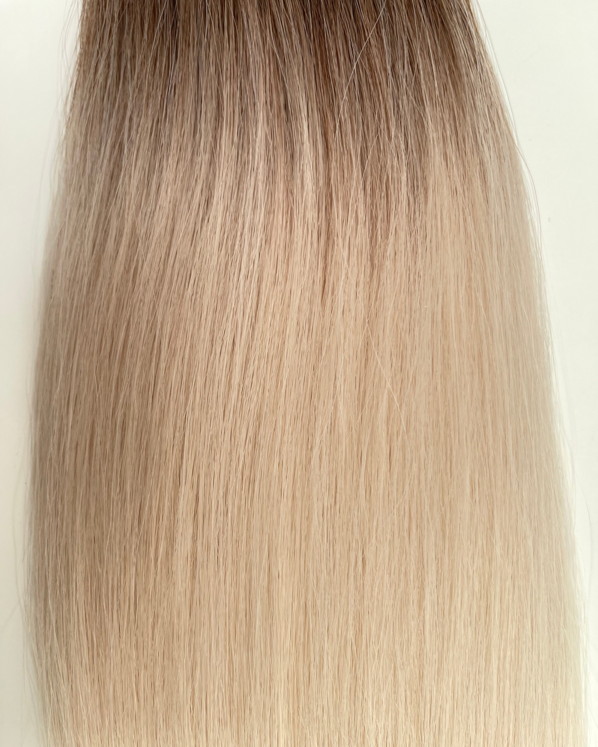26” 200g Tape-In Weft Bio-Protein Fibre Rooted Bleach Blonde